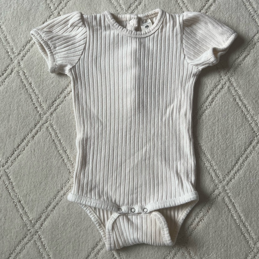 Kate Quinn Organic Cotton Ribbed Onesie